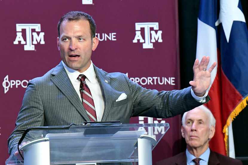 New Texas A&M athletic director Ross Bjork, left, addresses media and A&M athletic staff in...