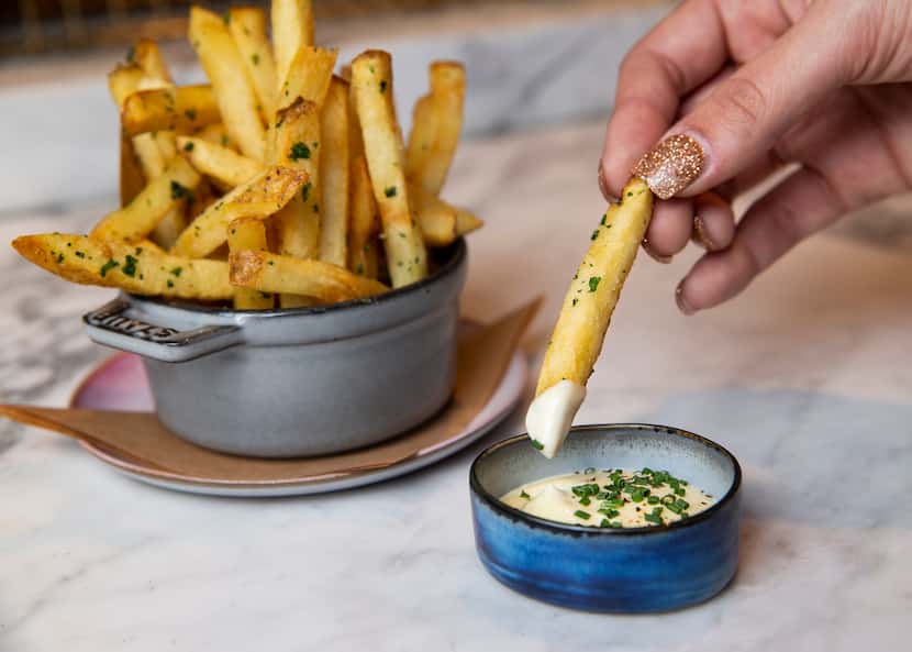 The Commons Club dijonnaise served with Kennebec fries inside the Virgin Hotel on Jan. 16,...