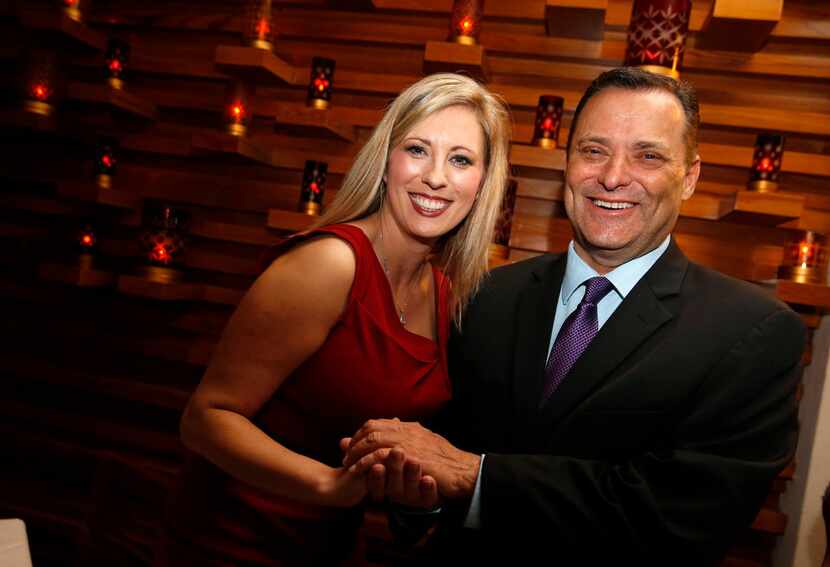 Ericka Downey (left) talks to Texas Tech coach Billy Gillispie pose for a portrait during a...