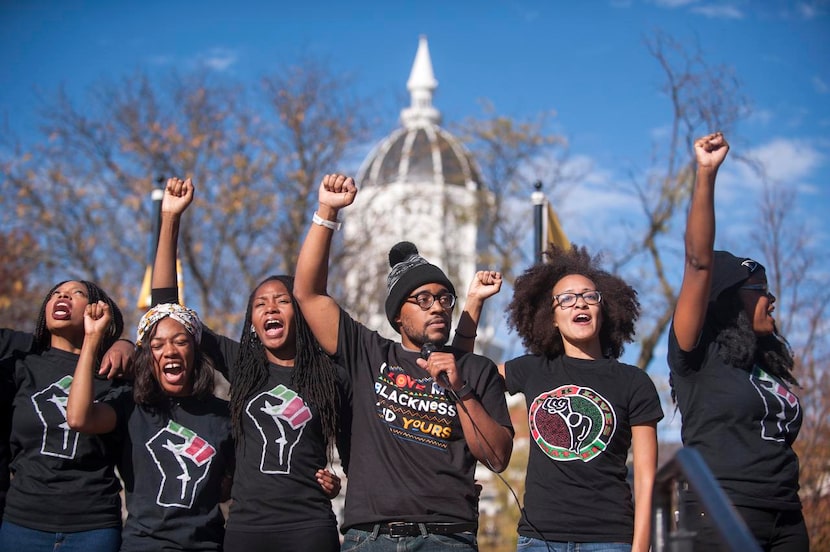 
Jonathan Butler (center), whose hunger strike drew vast attention to complaints about the...