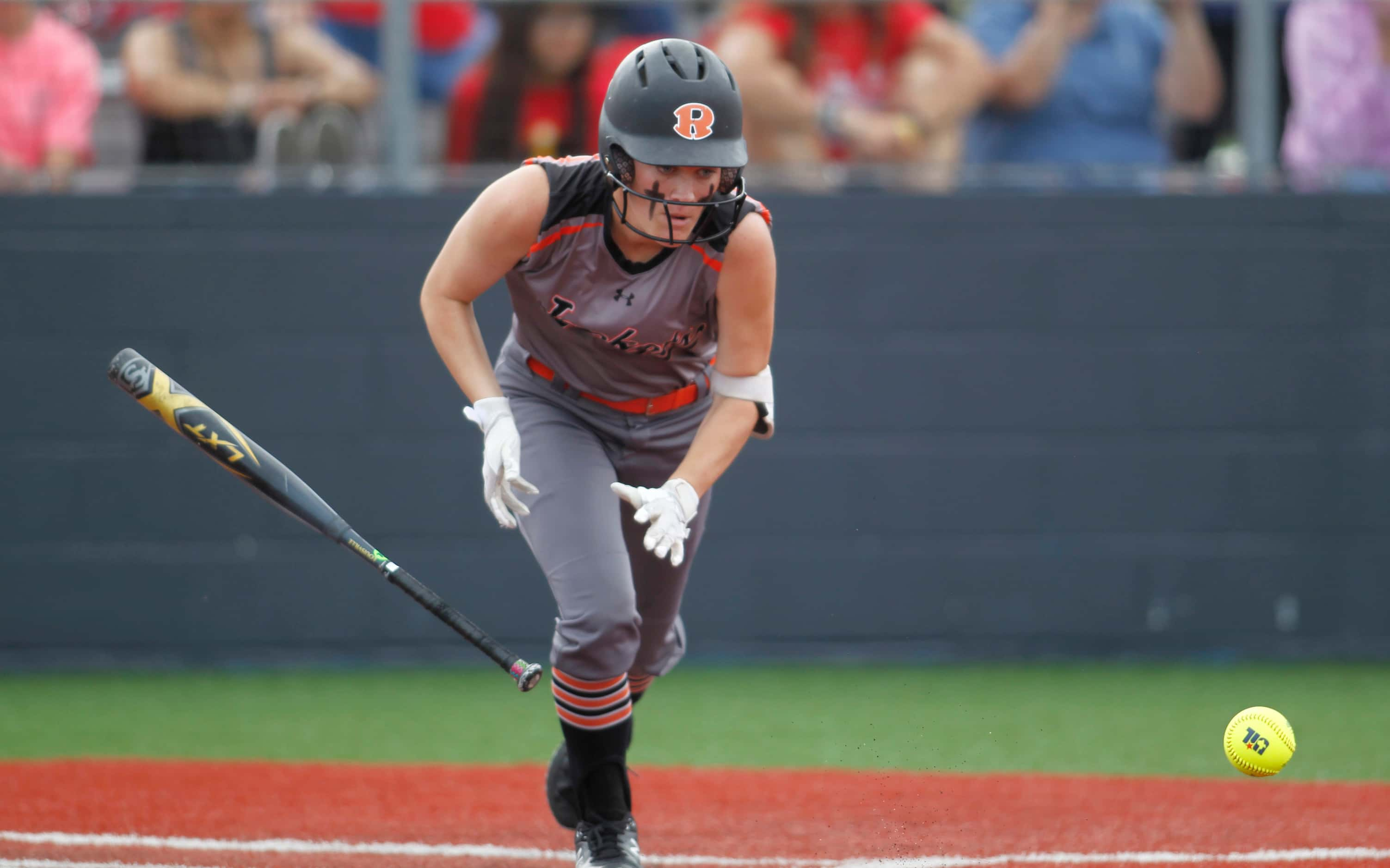 Rockwall's Logan Nies (6) hustles to first base after laying down a bunt during the top of...