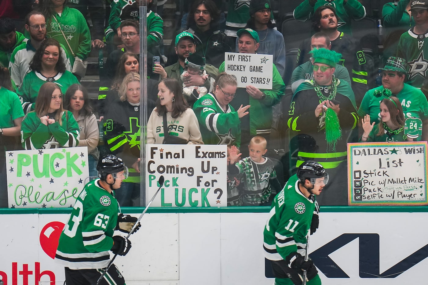 Fans cheer Dallas Stars center Logan Stankoven (11) and right wing Evgenii Dadonov (63) as...