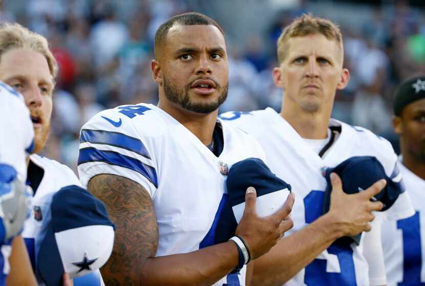 Dallas Cowboys quarterback Dak Prescott (4) and Dallas Cowboys quarterback Luke McCown (3)...