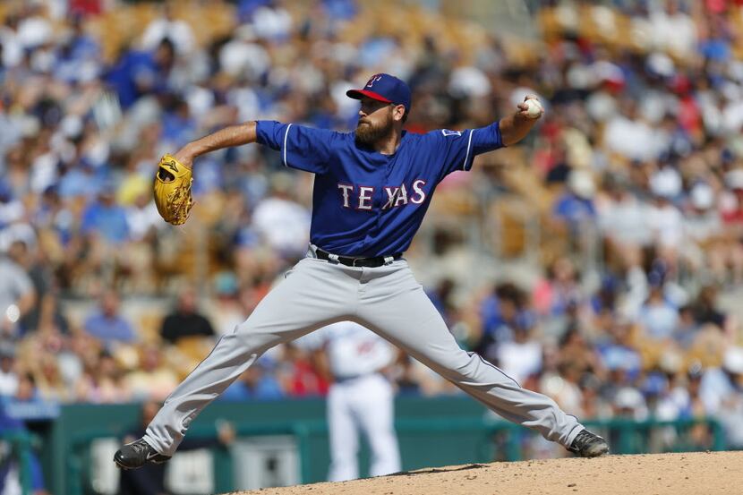 Texas Rangers pitcher Michael Kirkman throws during an exhibition baseball game in Glendale,...