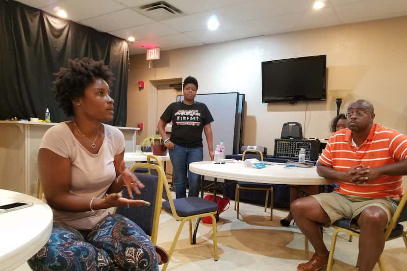 About three dozen black North Texas residents, including (from left) Alawna Burrell, Chantel...
