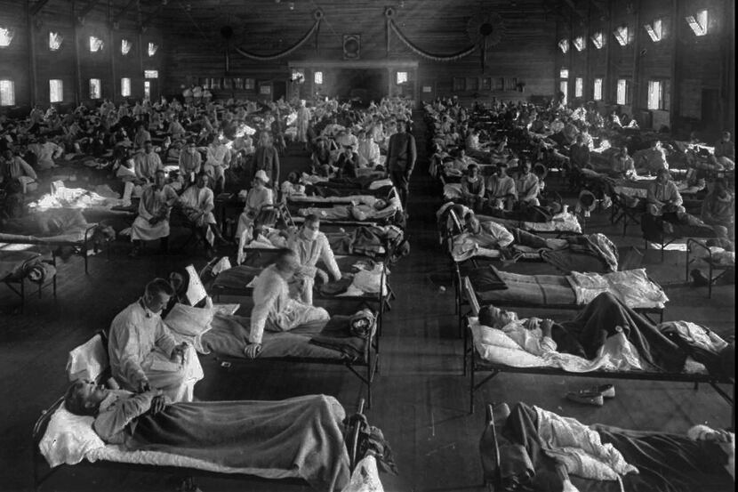 Victims of the 1918 Spanish influenza crowded into an emergency hospital at Fort Riley, Kan....