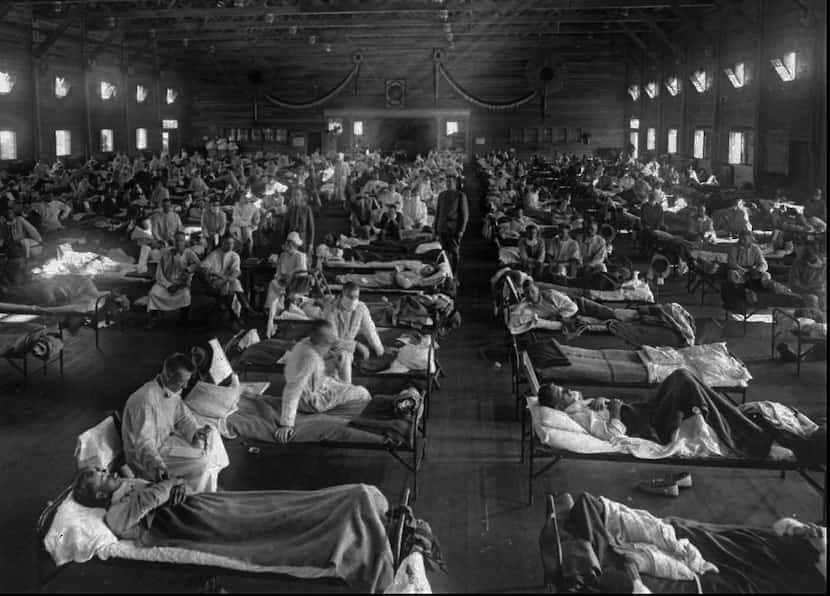 Victims of the 1918 Spanish influenza crowded into an emergency hospital at Fort Riley, Kan....