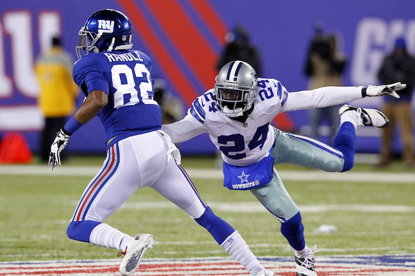 Dallas Cowboys cornerback Morris Claiborne (24) reaches for New York Giants wide receiver...