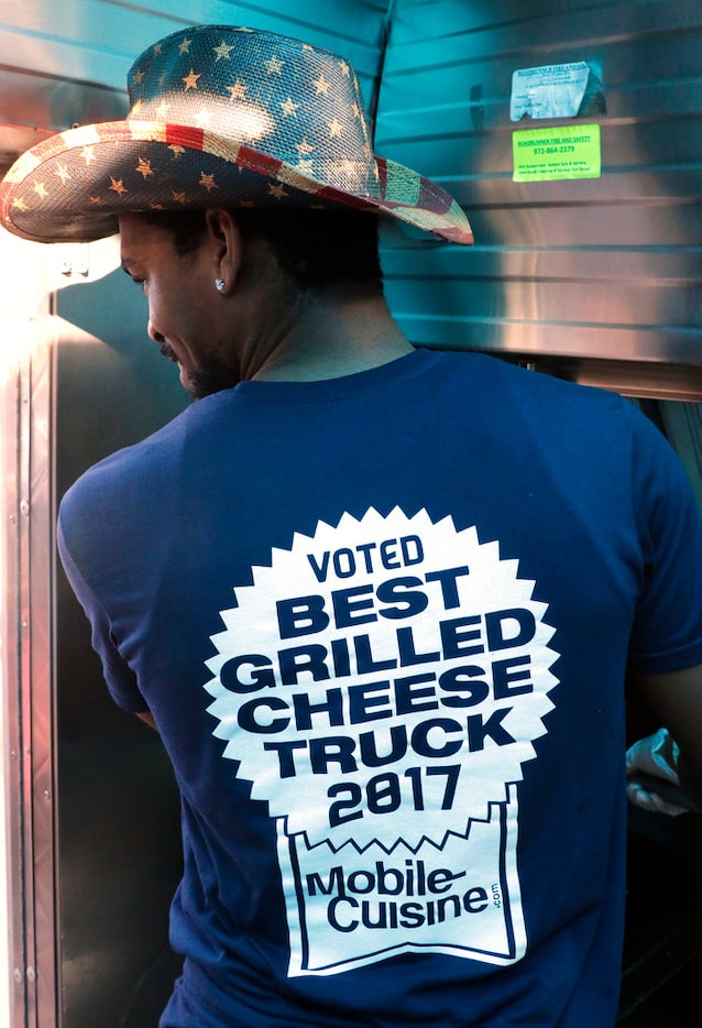 Driver Berny Mayfield displays a Ruthie's food truck message on his work shirt while making...