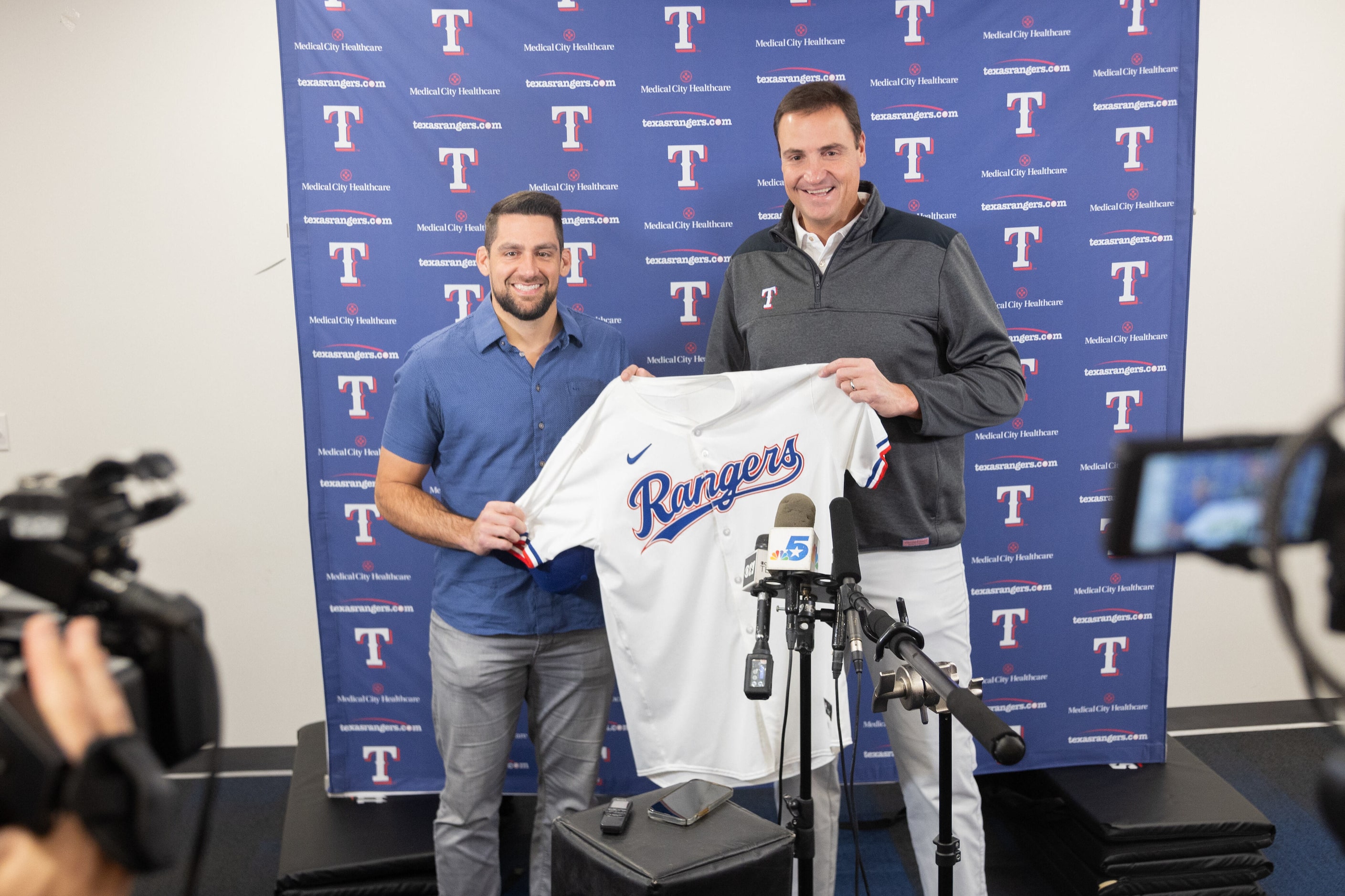 Texas Rangers starting pitcher Nathan Eovaldi (left) and Rangers GM Chris Young pose for a...