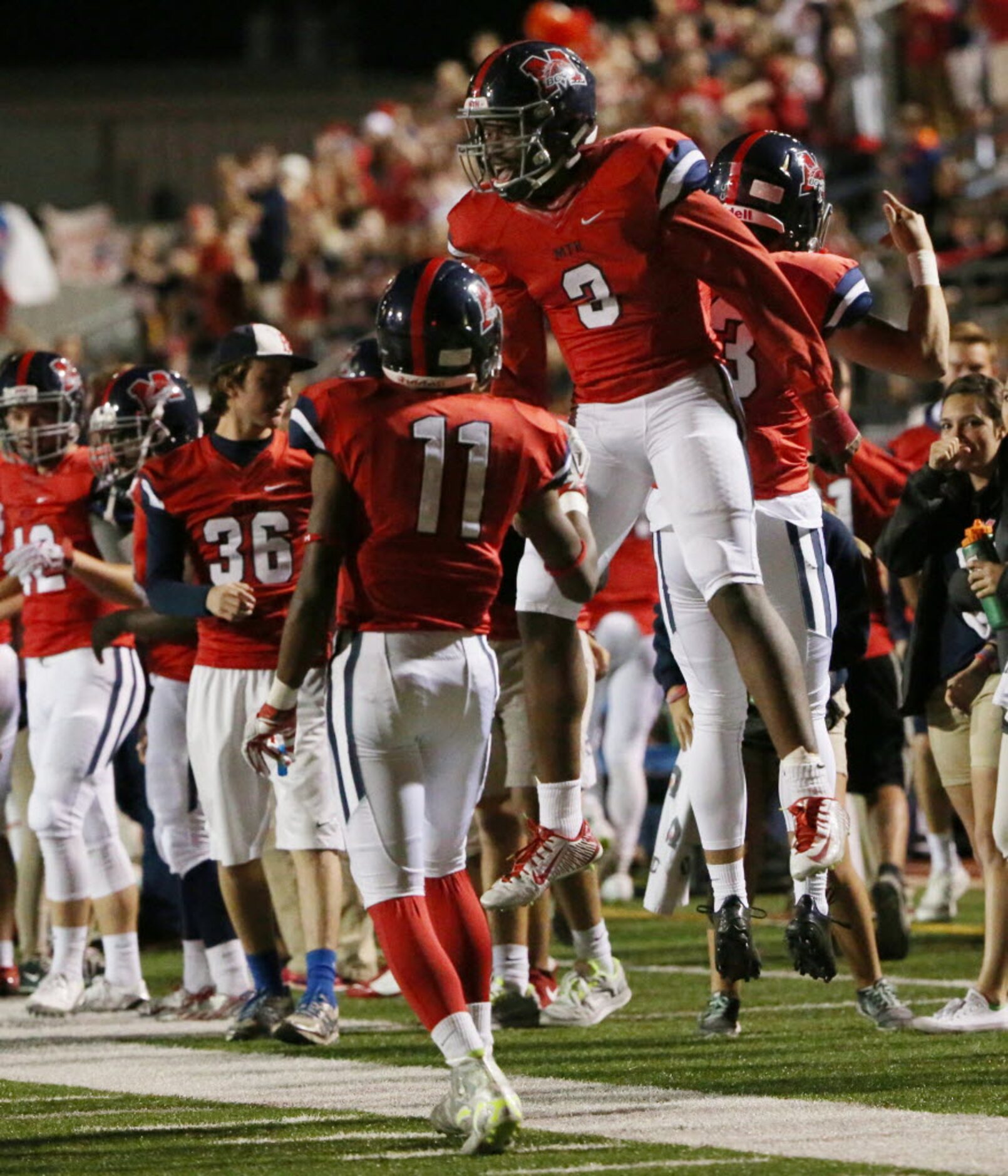 McKinney Boyd running back Stephen Driskell (3) celebrates with teammates after scoring a...