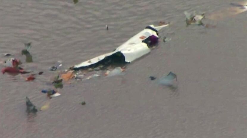 This image taken from video provided by KRIV-TV (FOX 26) shows the wreckage of a cargo plane...