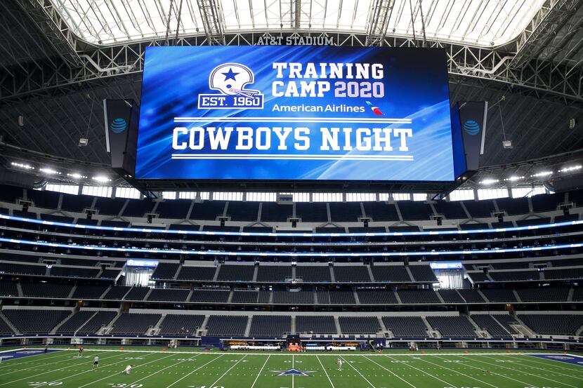 Dallas Cowboys players warmup before the start of practice on Cowboys Night during training...