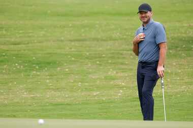 Former Dallas Cowboys quarterback Tony Romo watches his putt on the 9th green during the...