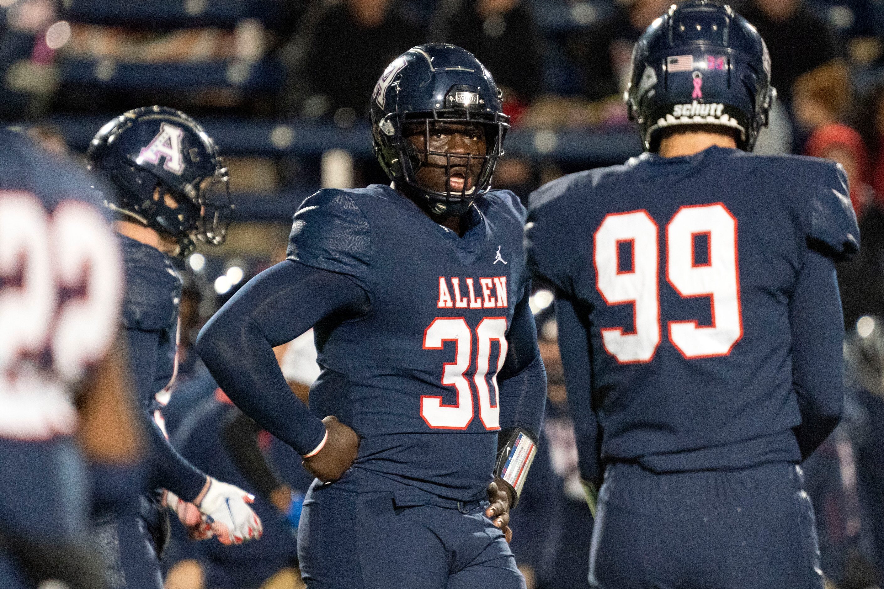 Allen junior defensive lineman DJ Hicks (30) pauses between plays during the first half of a...