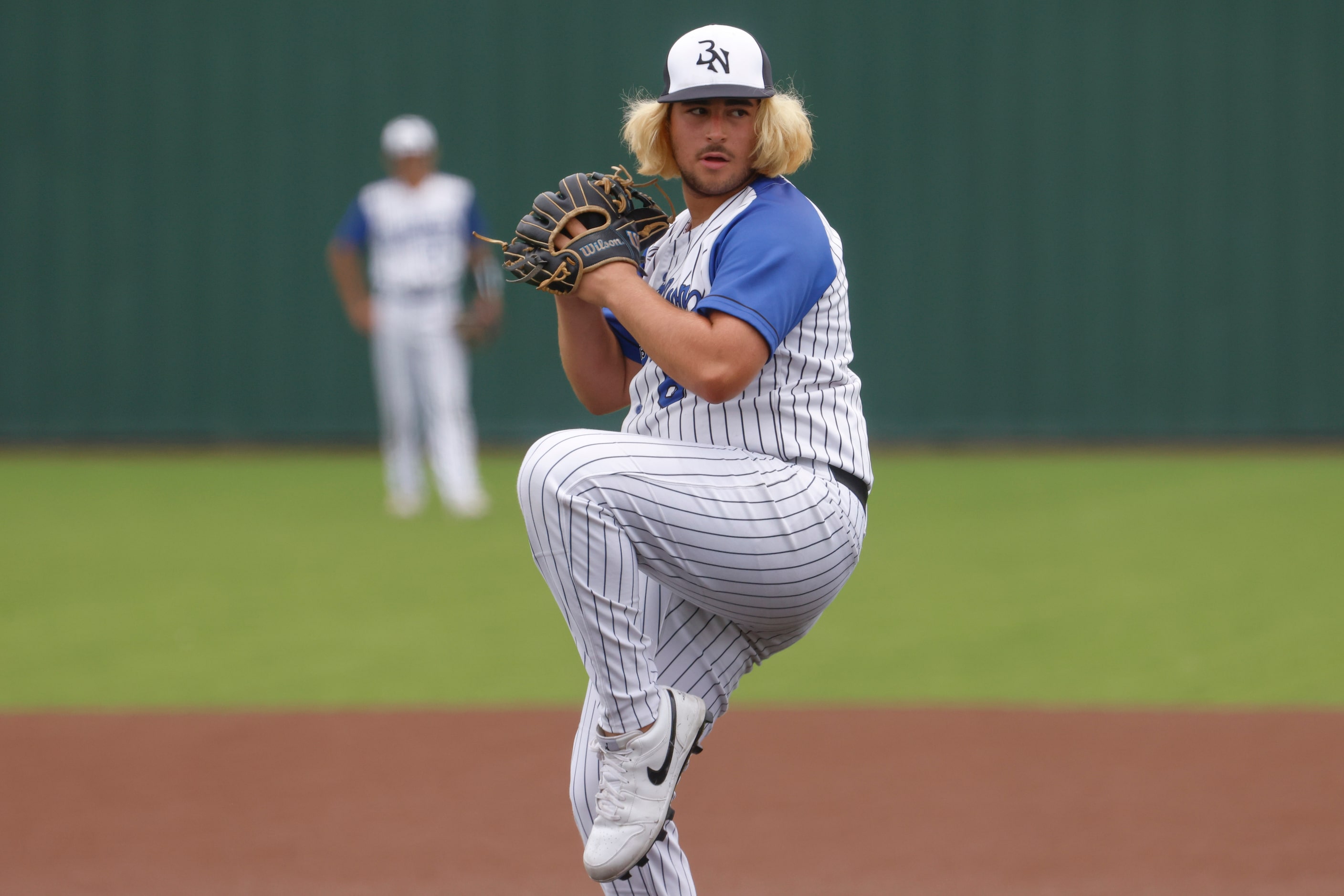 Byron Nelson High School’s Aeden Barron throws a pitch during the fifth inning of a baseball...