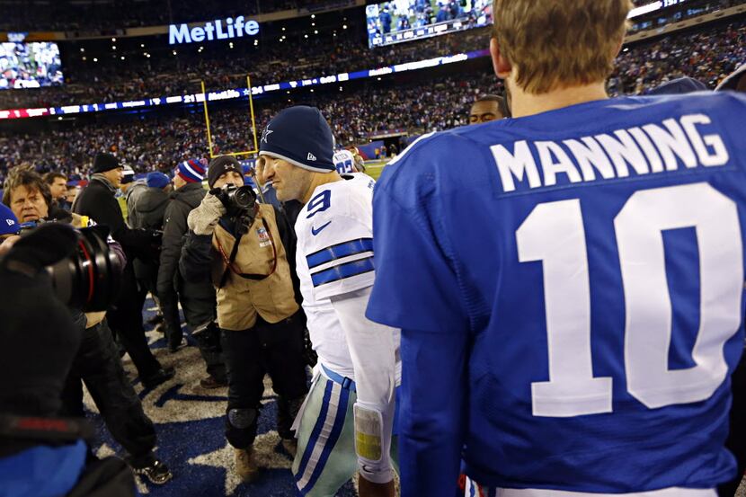 Dallas Cowboys quarterback Tony Romo (9) walks away after talking with New York Giants...