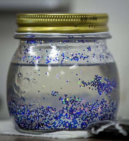 A "glitter jar" sits on a table with other tools for mindfulness at Davis Elementary Monday,...