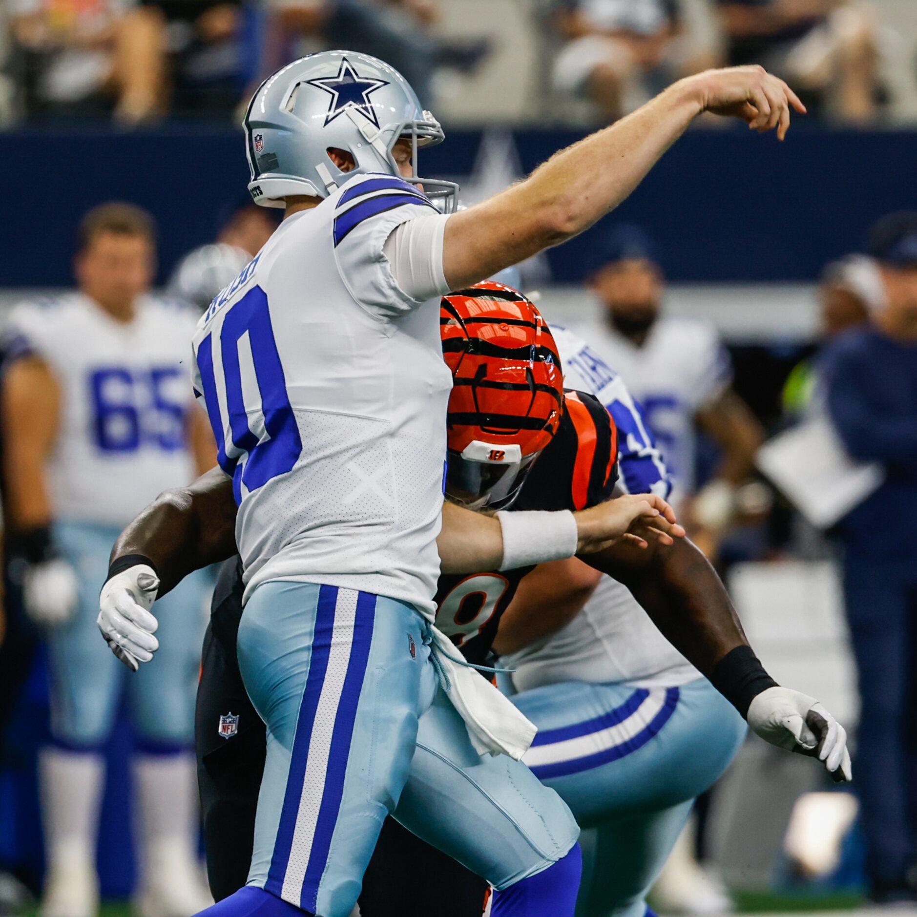 Dallas Cowboys quarterback Cooper Rush (10) makes a pass as Cincinnati Bengals defensive...