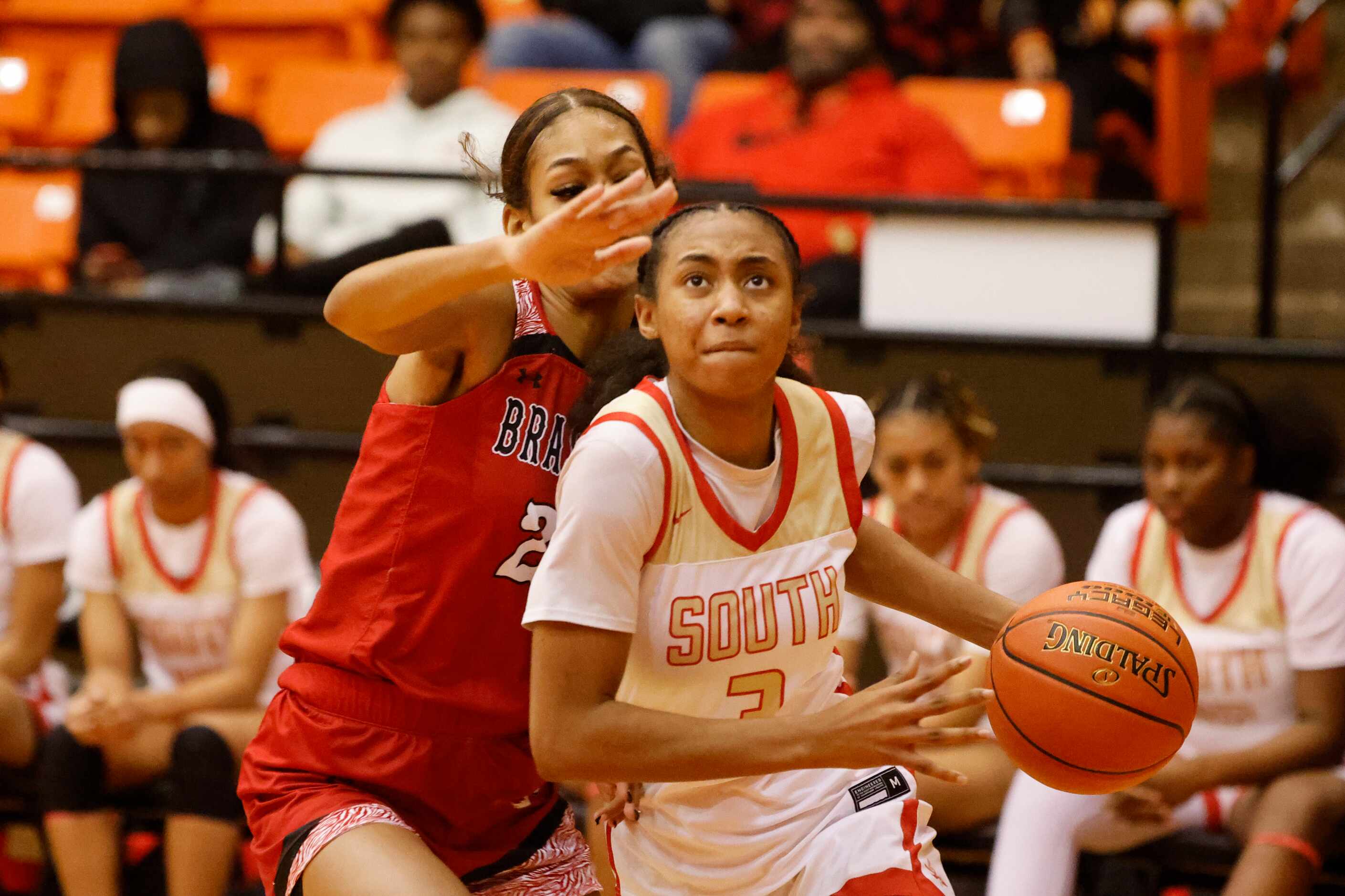 South Grand Prairie’s Taylor Barnes (3) drives past =Denton Braswell’s Yves Cox, right,...