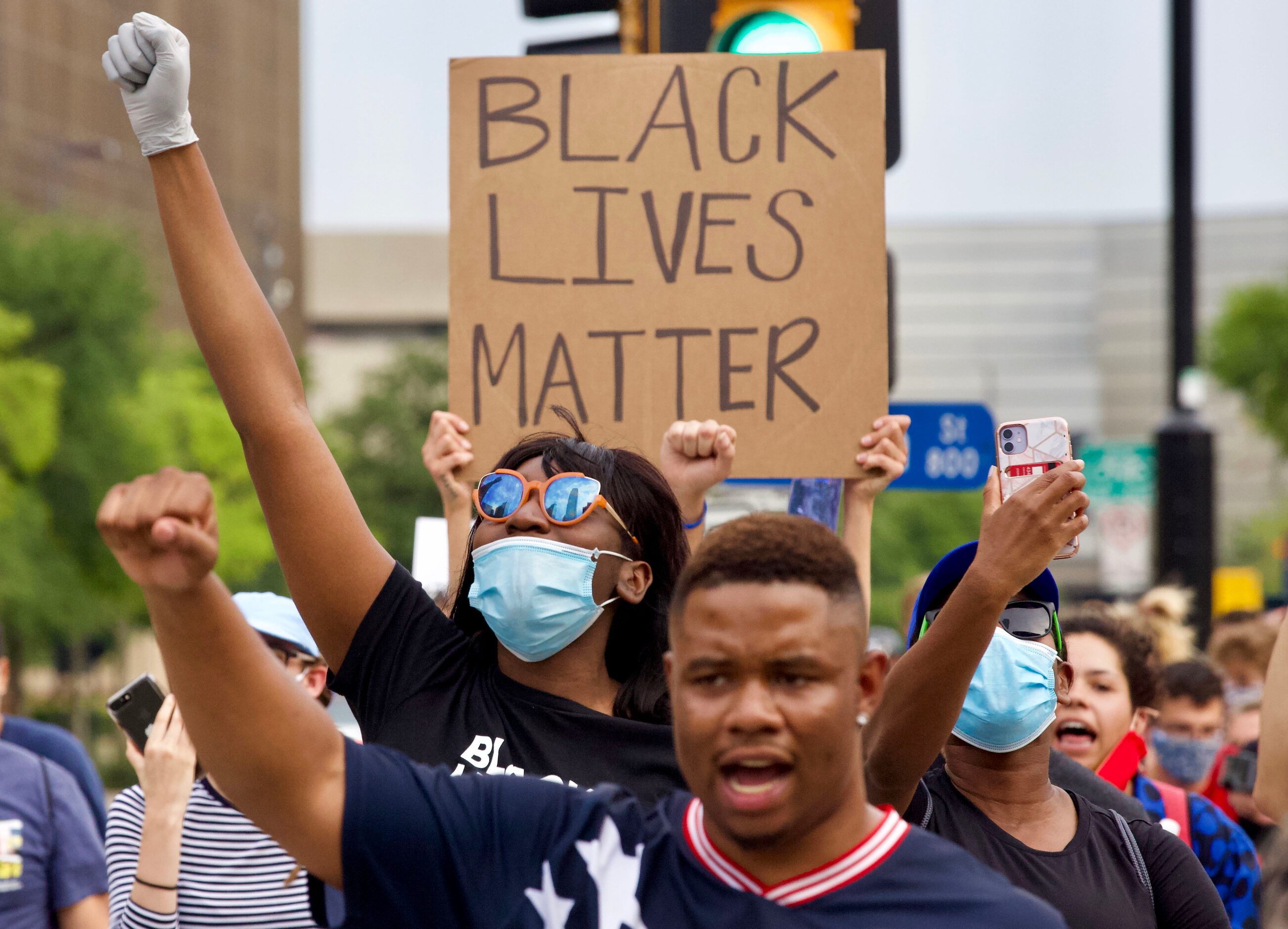 Protesters march to the Frank Crowley Courts building to avoid enforcement of the city’s 7...