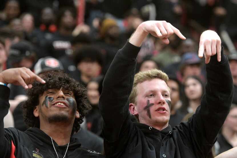 Texas Tech fans gesture "horns down" before an NCAA college basketball game against Texas,...