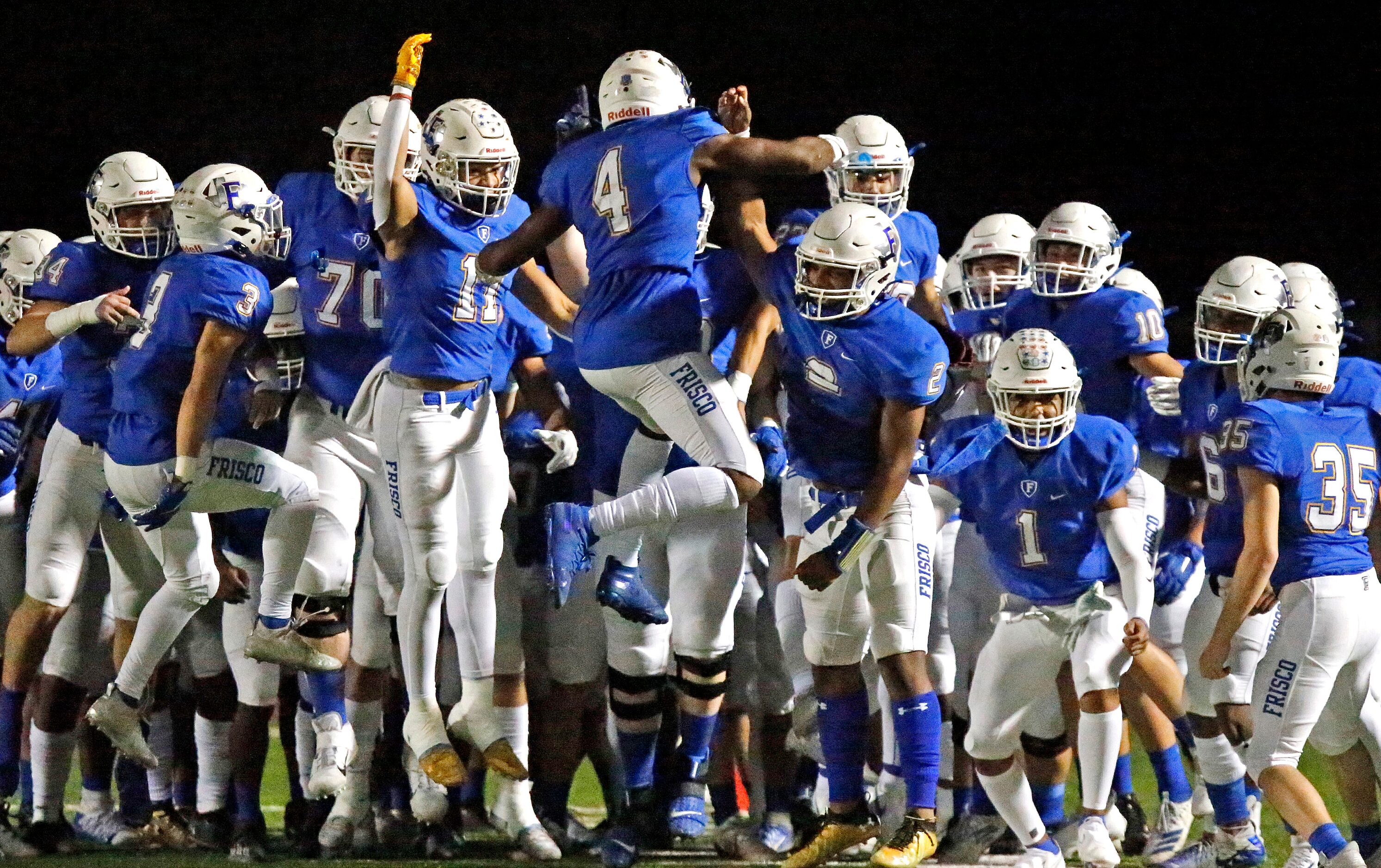 Frisco High School defensive back Chase Lowery (4) leaps into the air to fire up his team...