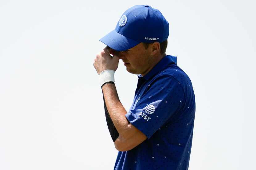 Jordan Spieth reacts after missing a putt on the third hole during the first round of the...