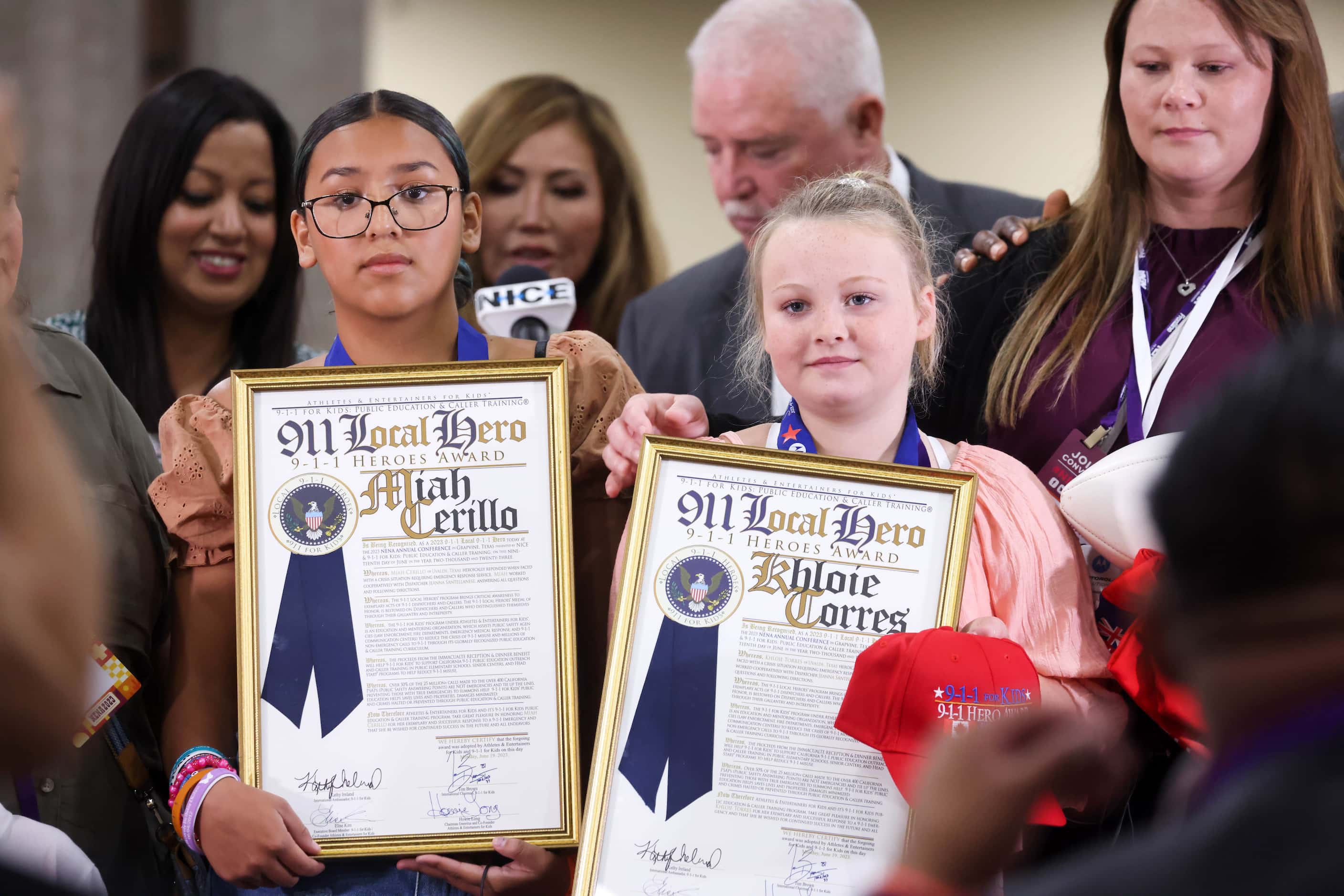 Miah Cerrillo (left) and Khloie Torres receive 9-1-1 Youth Hero awards for their role in...