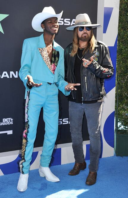 Lil Nas X, left, and Billy Ray Cyrus arrive at the BET Awards on Sunday, June 23, 2019, at...