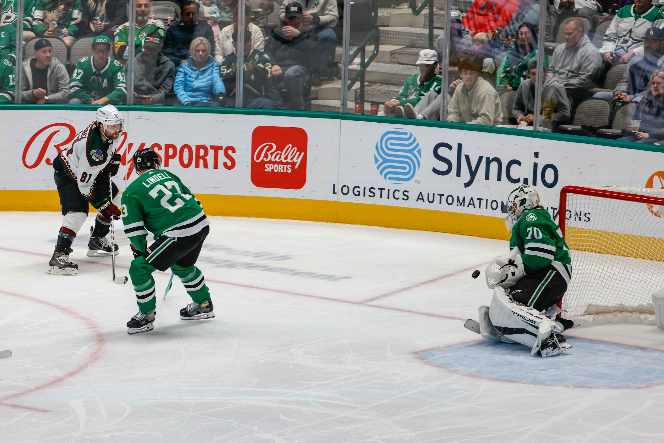 Dallas Stars goaltender Braden Holtby (70) stops a shot to the net by Arizona Coyotes right...