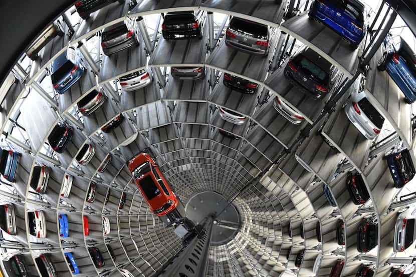  Towers of cars are stacked at Volkswagen's manufacturing plant in Wolfsburg, Germany....