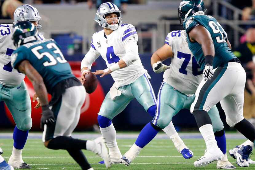 Dallas Cowboys quarterback Dak Prescott (4) looks to pass downfield against the Philadelphia...