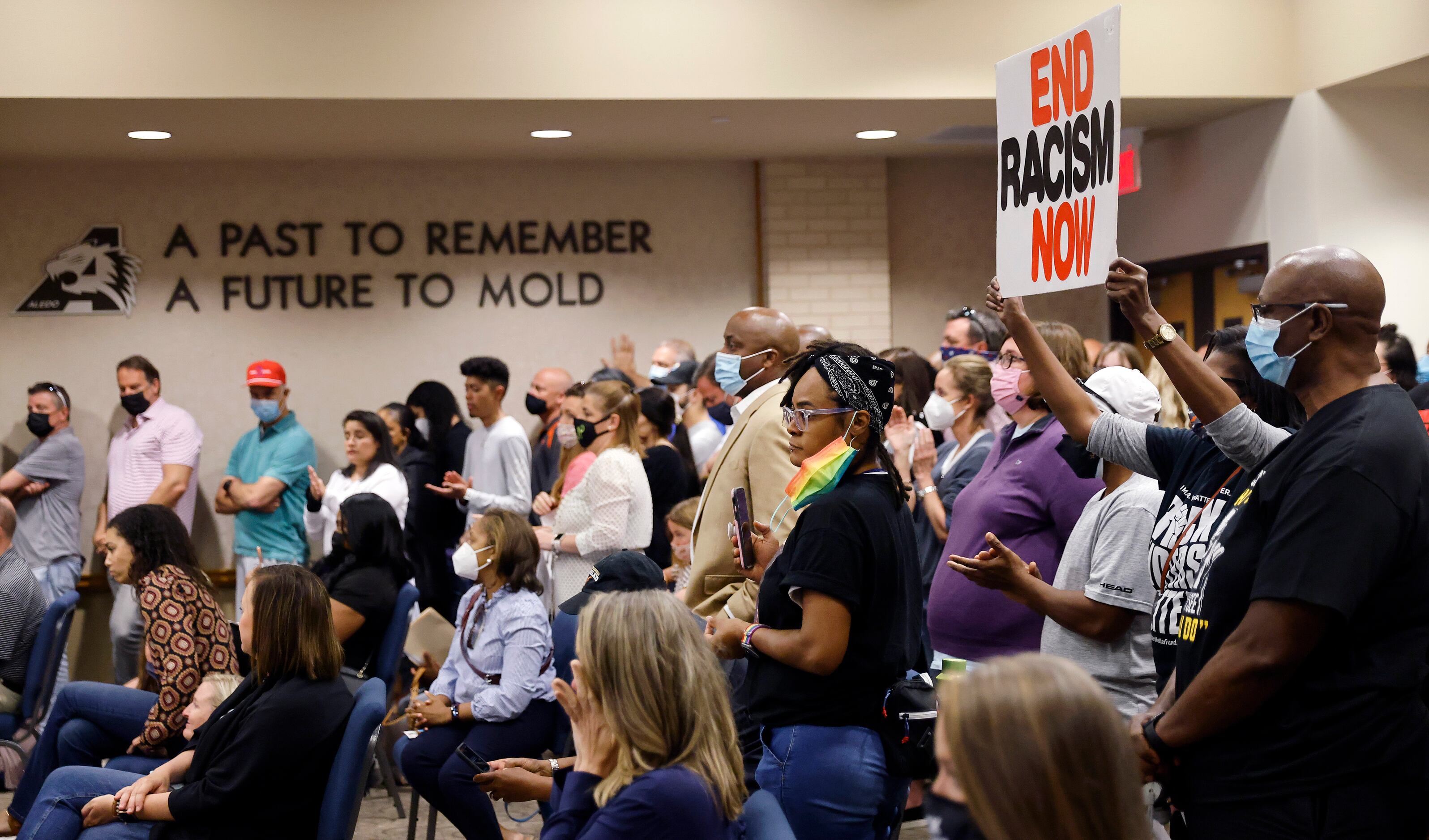 Parents and supporters gathered in the Aledo ISD school board chamber to voice their...