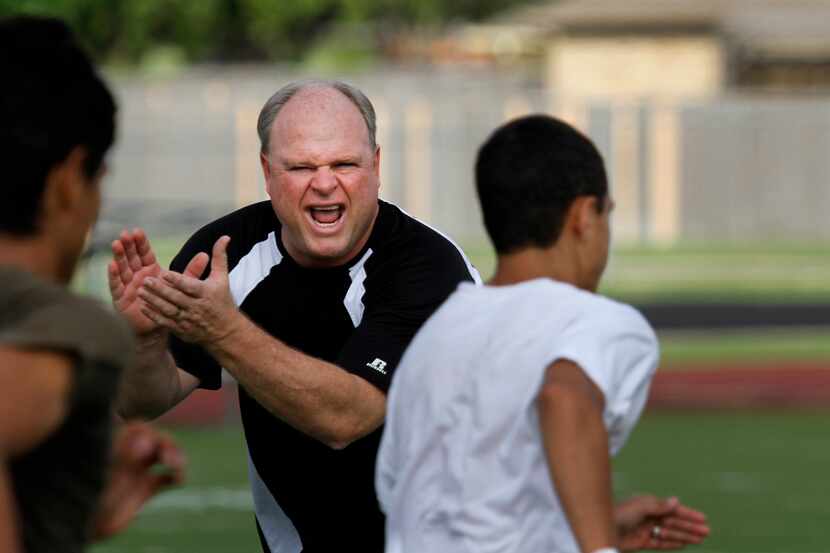 Jim Ledford, head football coach and athletic coordinator at Berkner High School, cheers up...