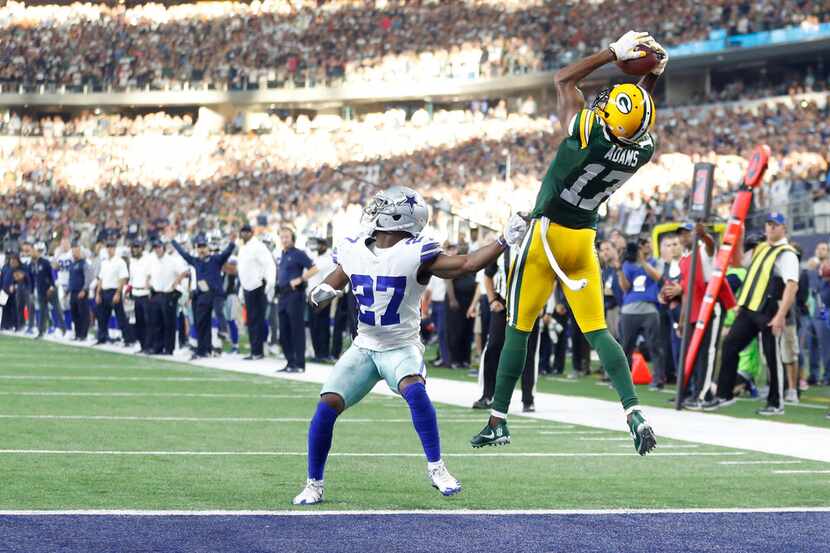 Green Bay Packers wide receiver Davante Adams (17) catches the game-winning touchdown over...
