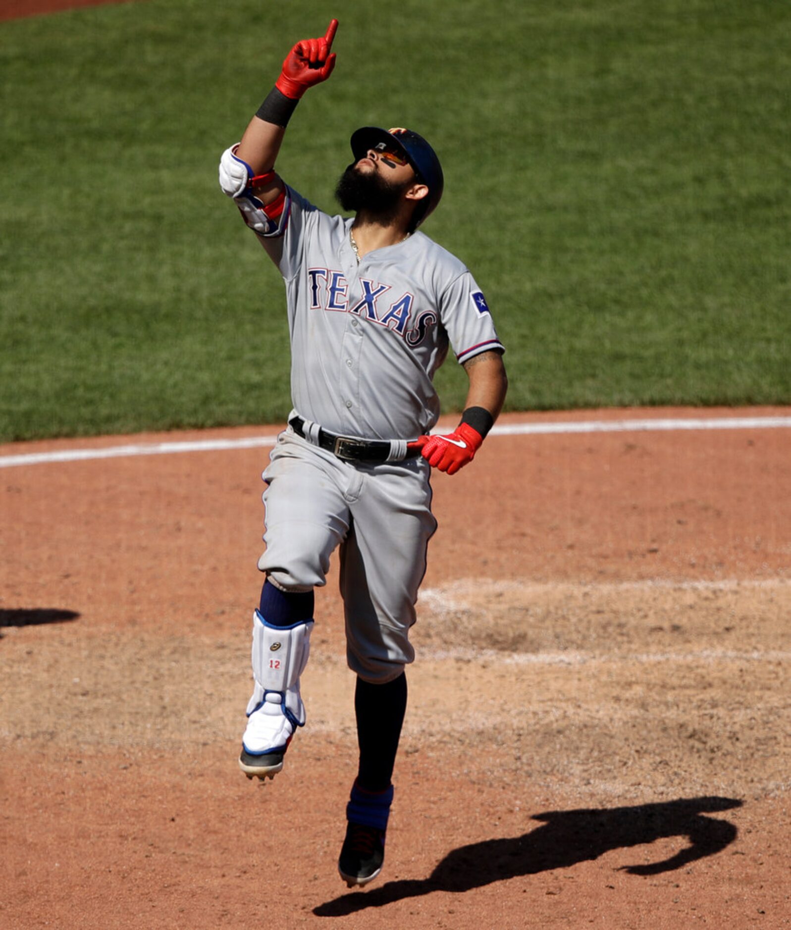 Texas Rangers' Rougned Odor celebrates after crossing home plate after hitting a two-run...