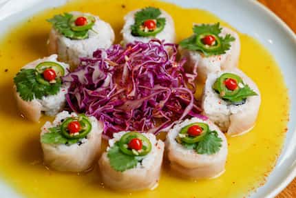The Frida Roll at Quince in Fort Worth is made with yellowtail and avocado, with serrano and...