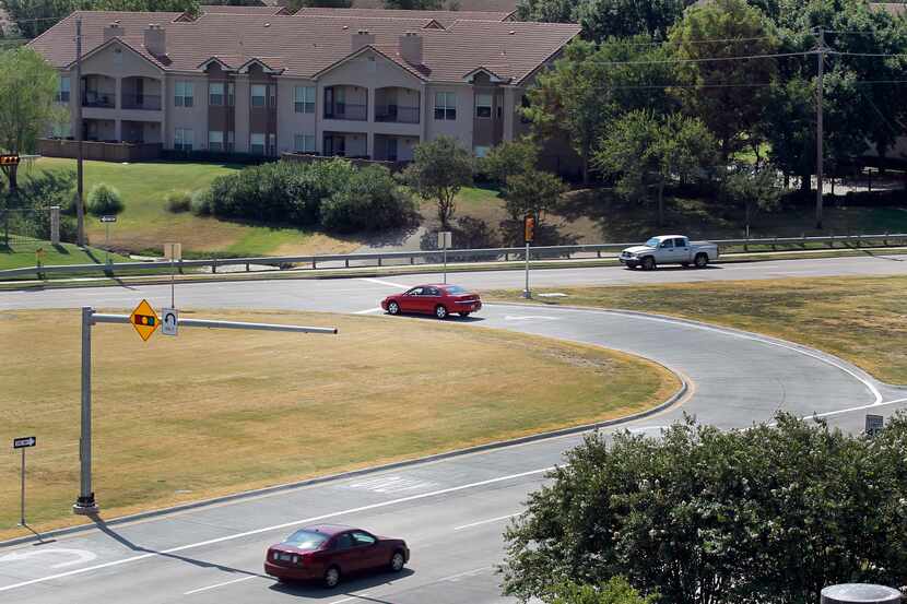 Motorists negotiation a "Michigan left turn" from Preston Road onto Legacy Drive in Plano....
