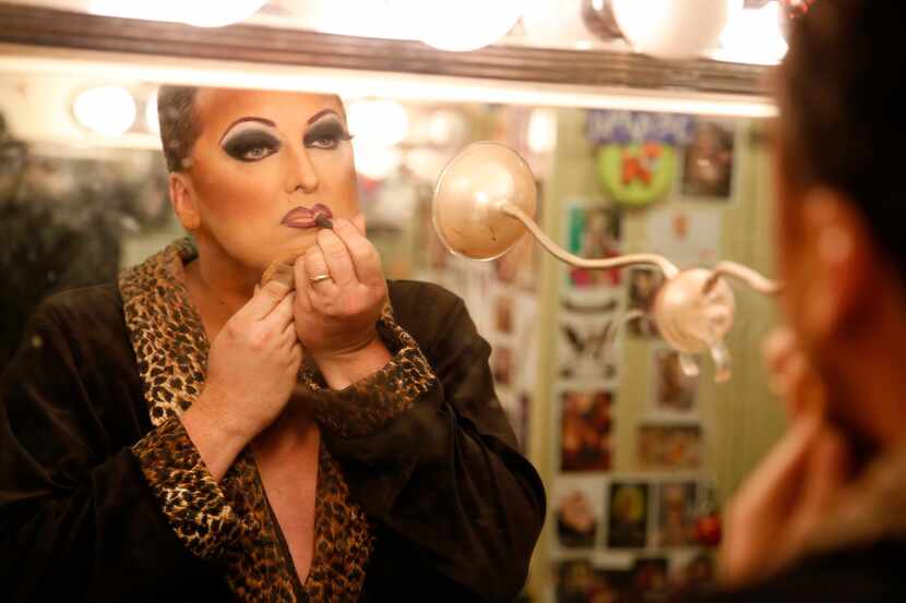 James Love applies his makeup before performing as "Cassie Nova" at Sue Ellen's in Dallas,...
