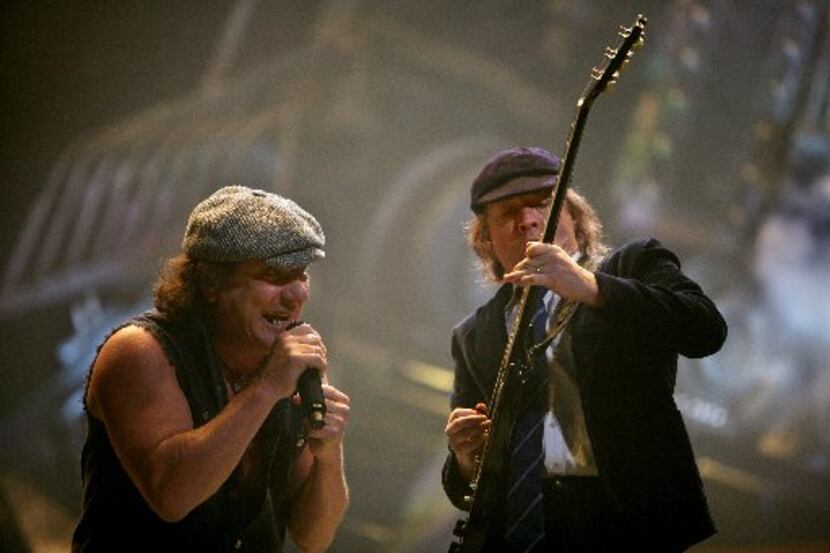 Brian Johnson, left, and Angus Young of AC/DC perform at the American Airlines Center Friday...