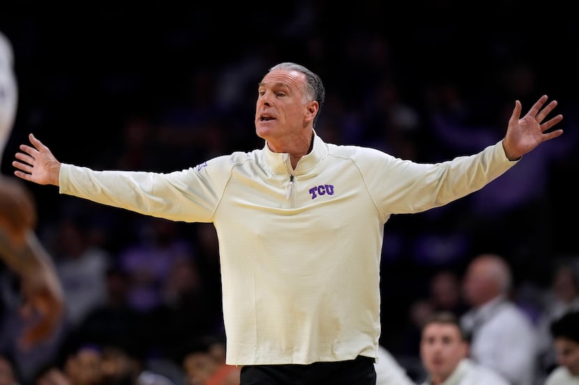 TCU head coach Jamie Dixon reacts to a call during the first half of an NCAA college...