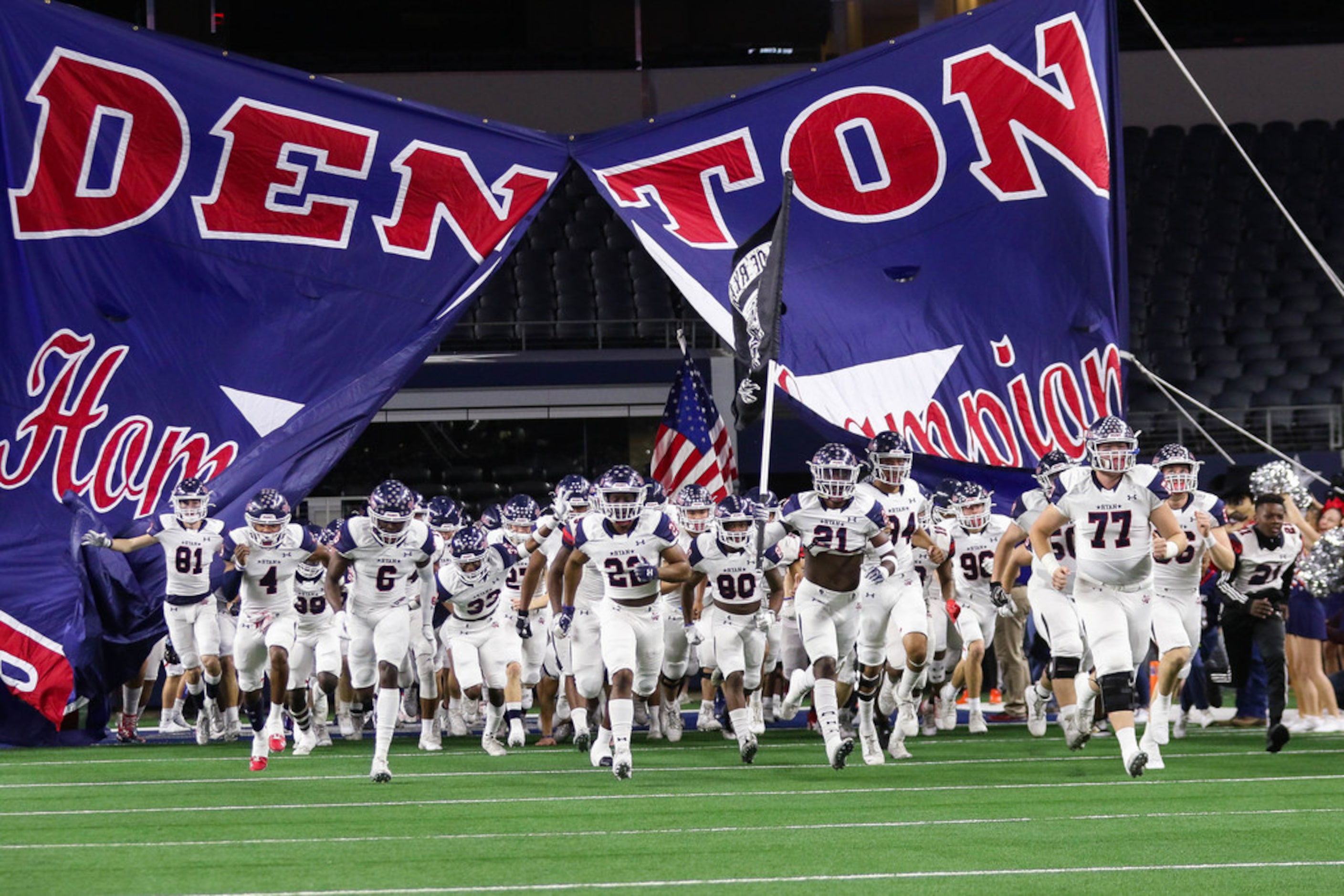 Denton Ryan runs out before a Class 5A Division I state championship game against Alvin...