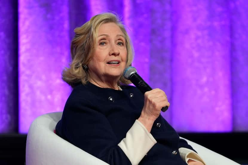 FILE - Former Secretary of State Hillary Rodham Clinton speaks with Catalyst CEO Lorraine...