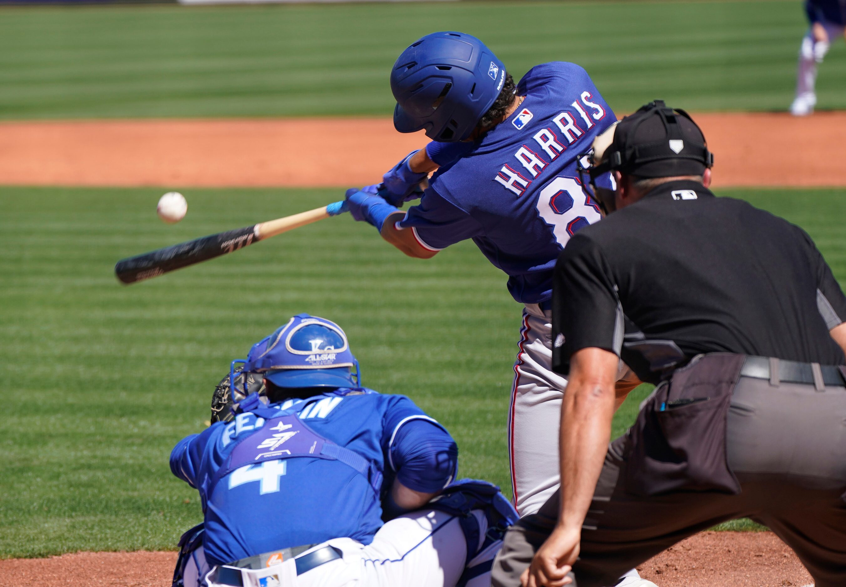 Baseball’s back and Texas Rangers’ Dustin Harris gets a hit during their game against the...