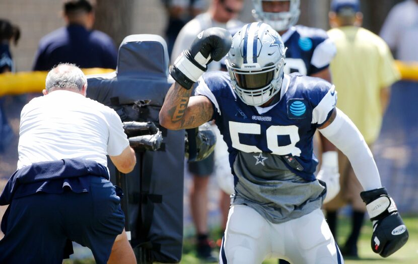 FILE - Dallas Cowboys defensive end Damontre Moore (58) runs through a drill during practice...