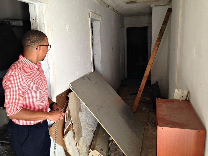 Dallas Area Habitat for Humanity's Reese Collins inside the remains of the small schoolhouse...