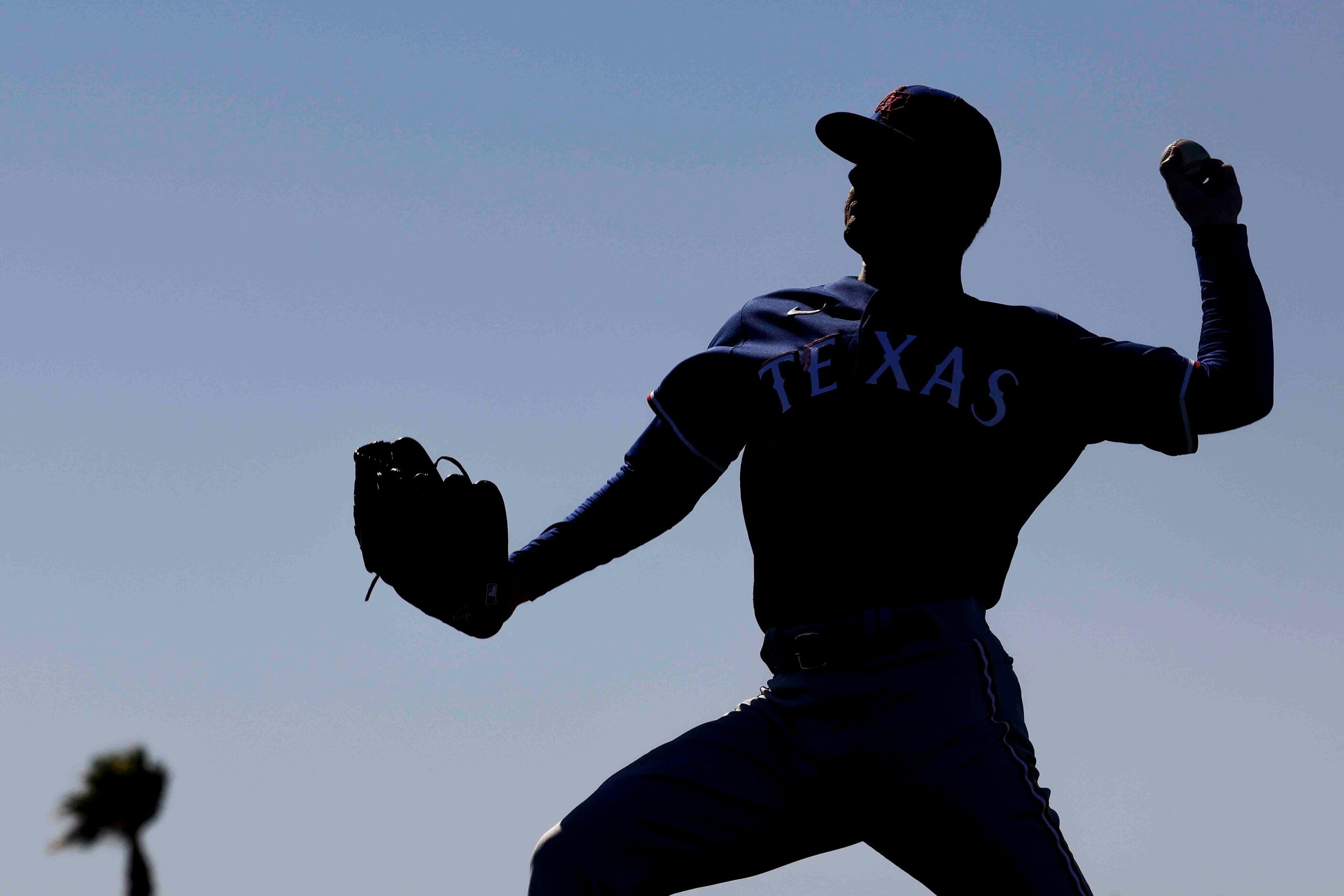 Texas Rangers left handed pitcher Cole Ragans participates in a drill during the first...