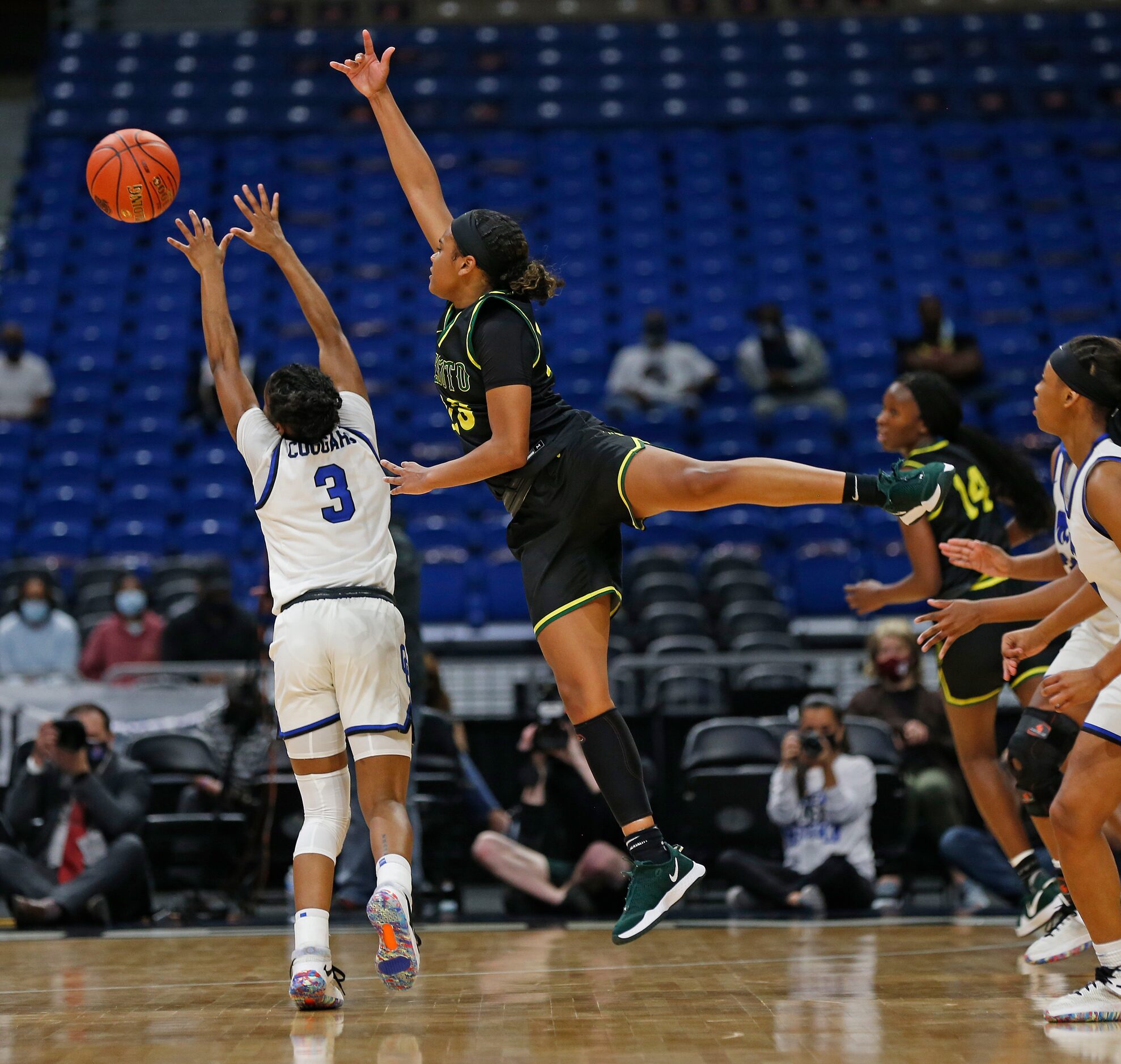 DeSoto Kendall Brown #23 tries to block the shot of Cypress Creek Rori Harmon #3. DeSoto vs....