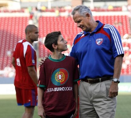 Former SMU and FC Dallas soccer coach Schellas Hyndman spends some time with his grandson...